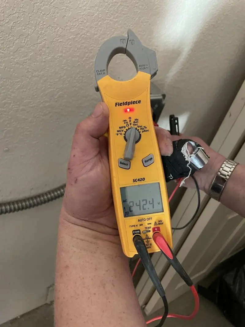 Voltage testing with clamp meter during Outlet Installation in Ashland